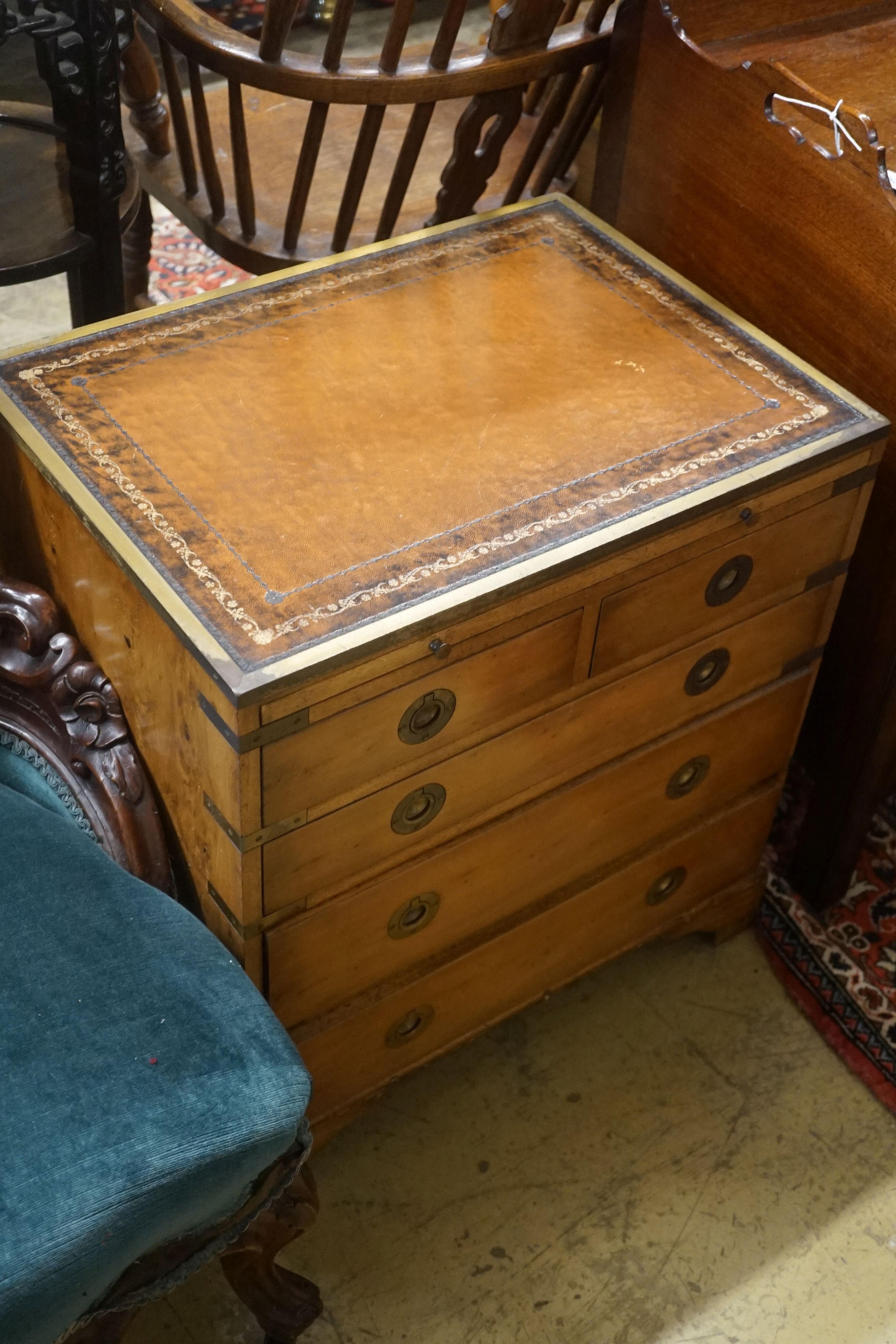 A pair of reproduction brass mounted military style yew veneered bedside chests with leather inset tops, width 56cm, depth 40cm, height 60cm